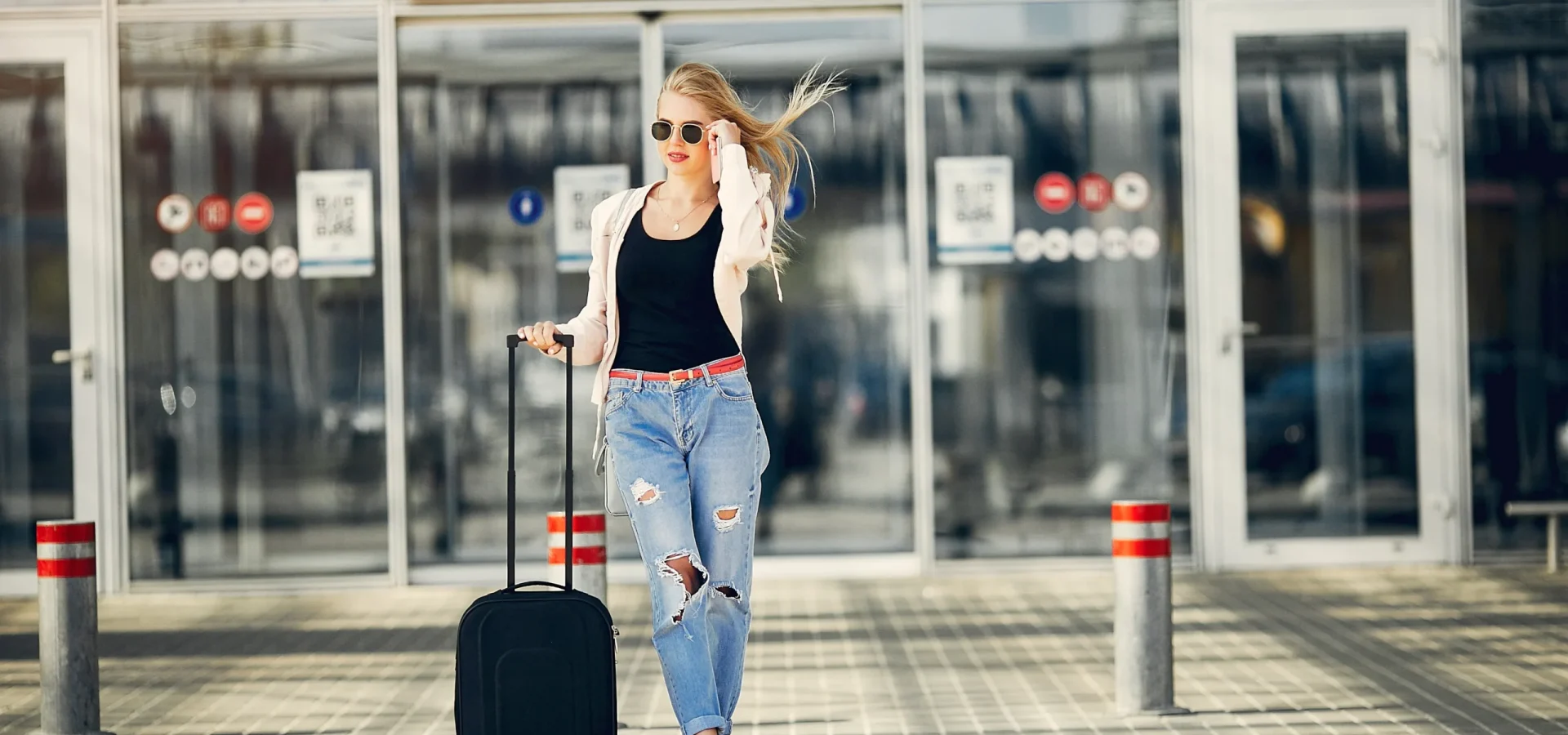 beautiful-girl-standing-airport waiting for maxi taxi by wheelchair taxi perth